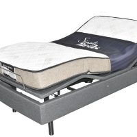 Adjustable bed with mattress